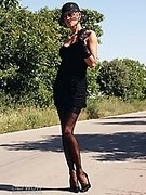 Leggy lady in sexy black vintage stockings, high heels and sexy short dress